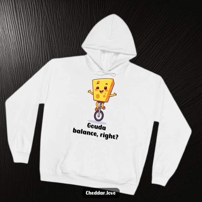 Funny Cheddar Cheese Hoodie: A grinning cartoon cheese character masterfully riding a unicycle, radiating pure happiness and balance.